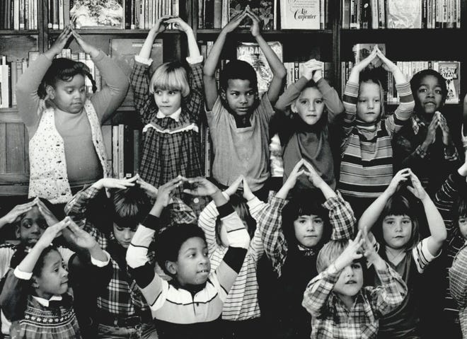 Students of Villa Teresa Catholic School sing and animate their holiday songs with hand motions during a Christmas party 40 years ago with neighboring senior residents at Classen Senior Center. This photo was published Dec. 16, 1981, in the Oklahoma City Times.