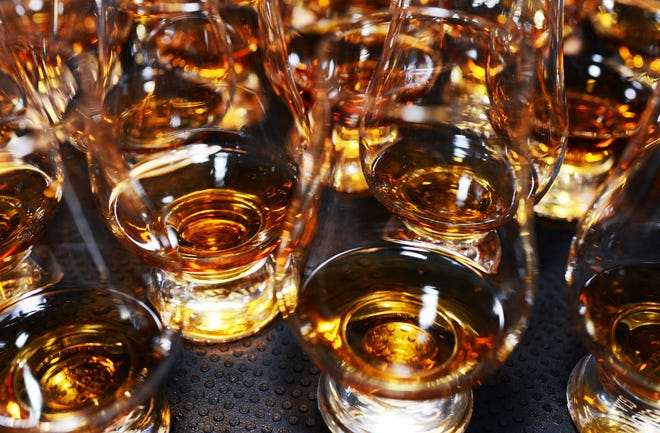 Amber sips at Okeechobee Steakhouse's "Beef N Bourbon Experience" dinner during the 2021 Palm Beach Food and Wine Festival.