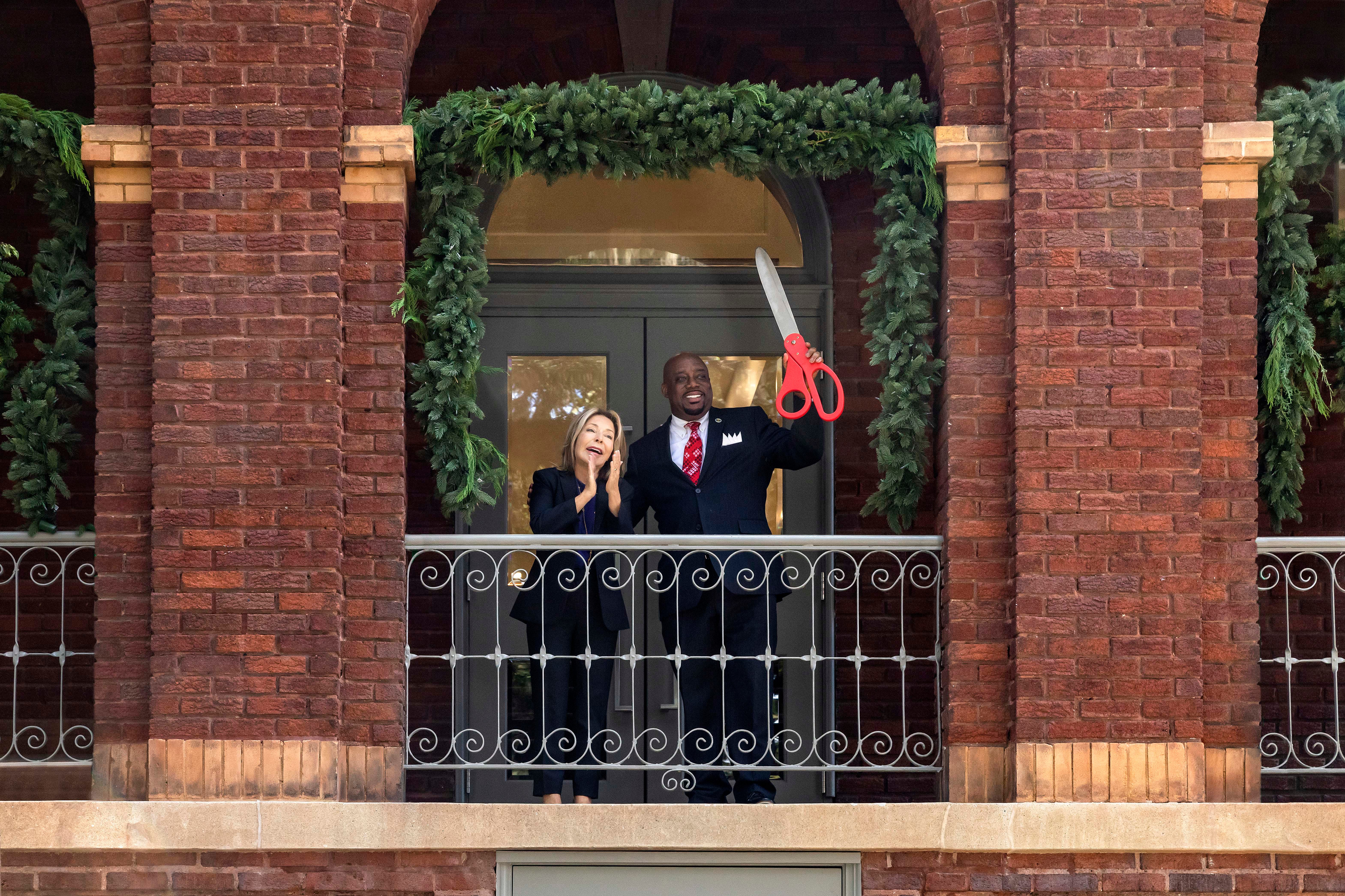 Savannah College of Art and Design Co-founder and President Paula Wallace, left, and Mayor Van Johnson cut the ribbon on SCAD's Lofts at Pulaski, a former student residence that the university adapted into 22 units of workforce housing aimed at providing affordable rent for downtown workers.