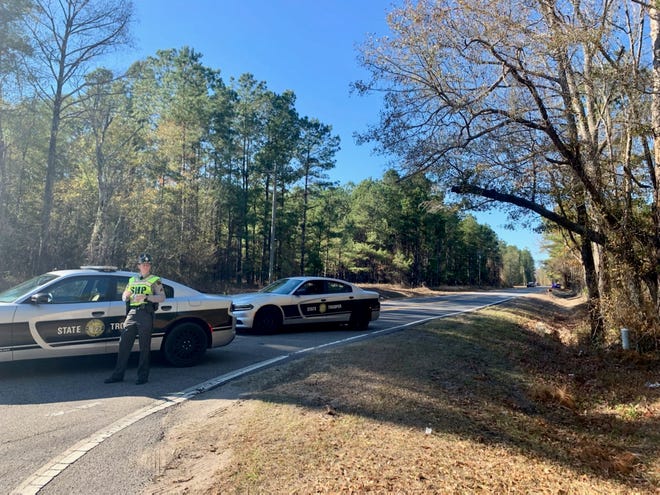 State troopers were redirecting traffic on N.C. 210 past the intersection at Morgan Road on Tuesday, Dec. 14, 2021, in response to an officer-involved shooting in Pender County.