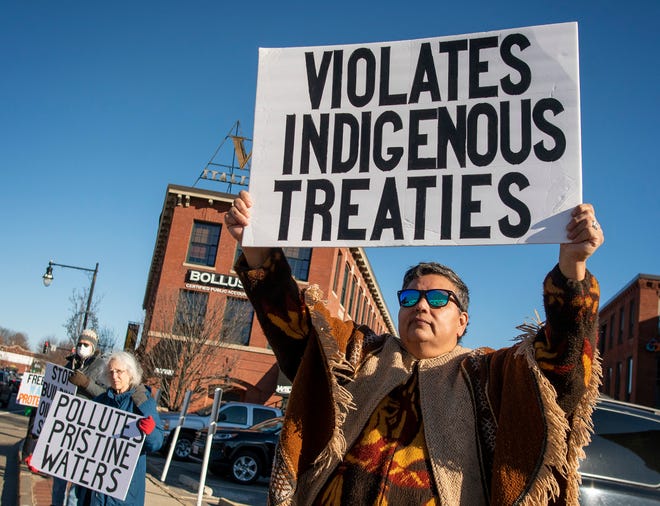 Rhonda Hicks, whose tribal name is Wahya Wolfpaw, and other climate activists hold a protest on Shrewsbury Street in Worcester Tuesday. They are opposed to the Line 3 pipeline that runs from Alberta, Canada through North Dakota and Minnesota en route to Enbridge’s terminal in Superior, Wisconsin.