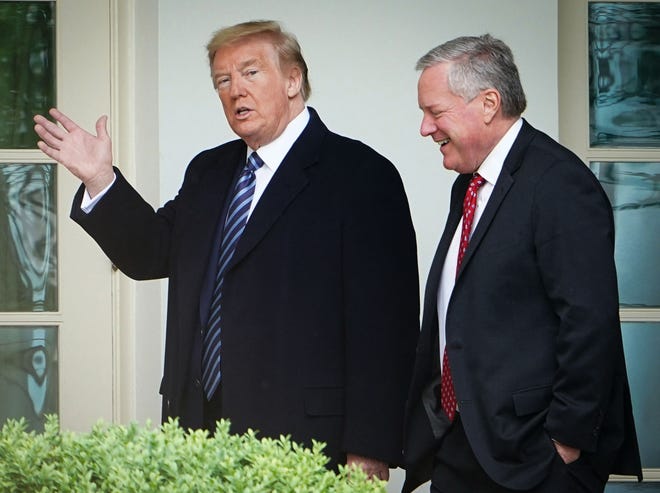 President Donald Trump walks May 8, 2020, with chief of staff Mark Meadows after returning to the White House from an event at the World War II memorial in Washington, D.C.