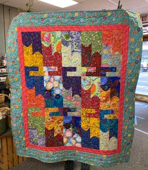 The Downtown Business Council raised the donated funds at their first Fall Festival in Penn Yan Nov. 6,  where they raffled this “Crazy Cat Lady” quilt, handcrafted and donated by Barbara Craig.