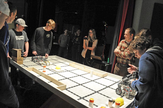 Each team of students preps their robot and releases it with their pre-programmed movements. The objective of this style of competition is to grab as many balls as possible to earn points, and do so without breaking any rules. In this match, one of the robots never loaded so the team was not able to earn any points.