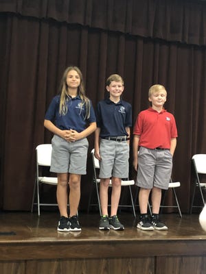 The fifth and sixth grade division winners are, left to right, Lauren Northrop, first place; Liam Maloney, second place; and Bryce Wilmont, third place.