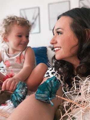 Kiersten Retter and her daughter, Abigail, 2. Retter is author of "I Am Perfectly Calm," a children's book she wrote to help defuse her toddler's temper tantrums.