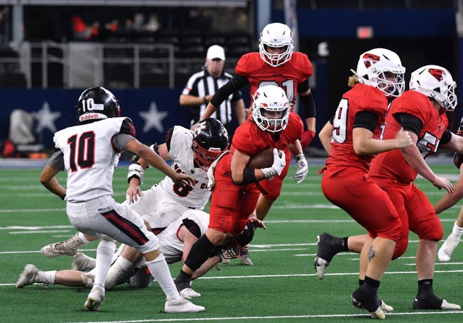 Strawn advances the ball during the Class 1A Div. II state championship game against Motley County at AT&T Stadium in Arlington on Wednesday, Dec. 15, 2021.