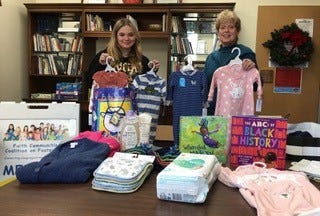 McKenna Smith (left) and Rev. Kate Thoresen organize items donated to the Faith Communities Coalition on Foster Care project at First Presbyterian Church. Many young women aging out of Foster Care become parents by age 21. The donated items will be given to them. They receive year around support as they face the challenge of independent living.