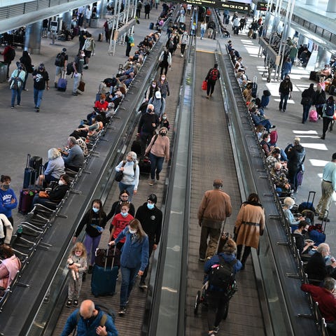 Travelers are seen at Denver International Airport