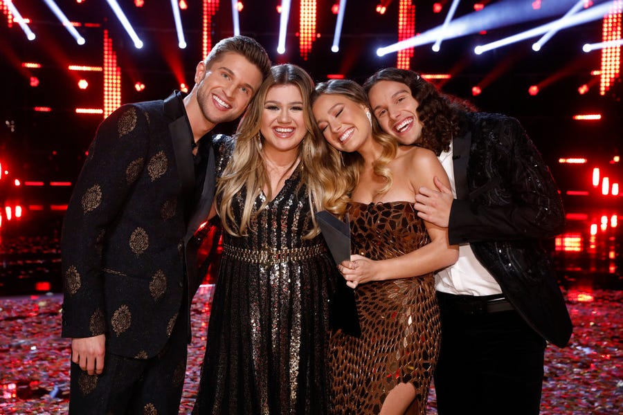 Kelly Clarkson celebrates with sibling trio Girl Named Tom, the first group to ever win.