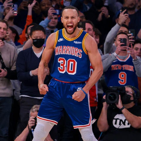 Steph Curry lets out a roar after sinking his reco