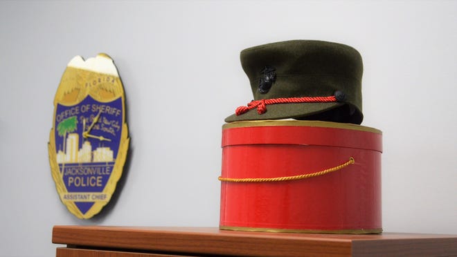 Assistant Chief Lolita Smith's U.S. Marine Corps uniform hat is on display in a corner of her new Zone 6 substation at 1680 Dunn Ave.