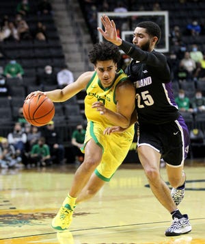 Oregon guard Will Richardson brings the ball up the court against Portland in December at Matthew Knight Arena.
