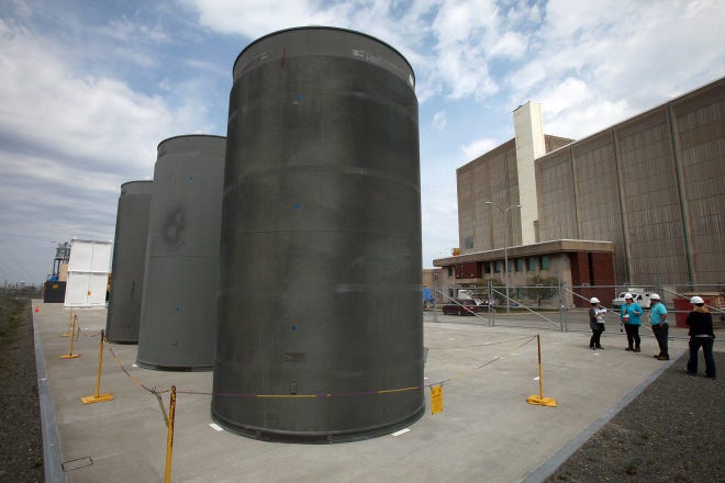 Dry casks store spent fuel at the Pilgrim Nuclear Power Plant in Plymouth, Mass. They are pictured here prior to the plant's closure in 2019.