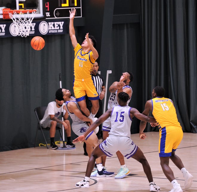 ACU's Coryon Mason, left, draws an offensive foul from Cal State-Bakersfield's Dalph Panopio (13) to preserve a 42-39 lead with 12:30 left in the game.