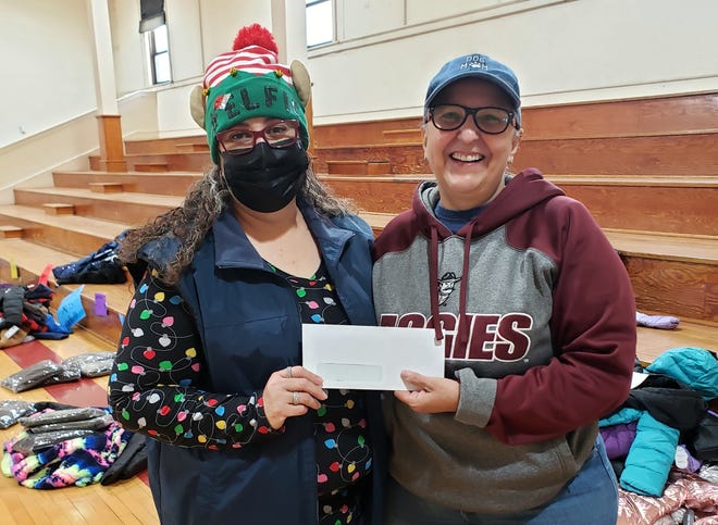 From left, Penny Gallosa of the Deming Benevolent and Protective Order of the Elks, Lodge 2750, presented Luna County Coats for Kids co-chair Christy Montes with a check in the amount of $500. The Elks donation will help the local nonprofit distribute close to 500 coats for children in Deming and Luna County.