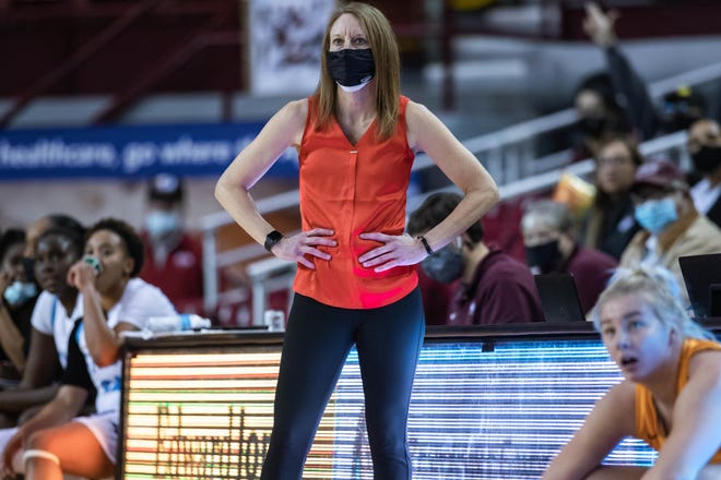 Head coach Brooke Atkinson stands on the sidelines as the NMSU Aggies face off against the UTEP Miners at the Pan American Center in Las Cruces on Wednesday, Dec. 15, 2021.