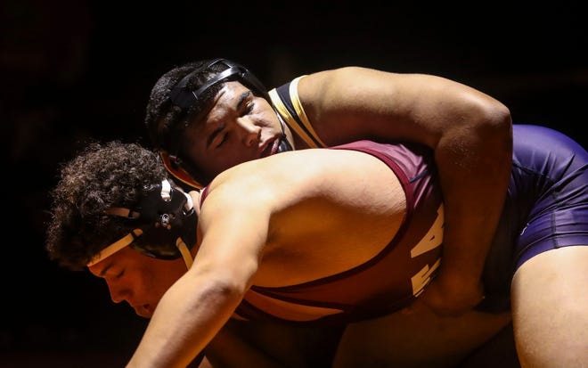 Palm Desert’s Daniel Herrera works for a hold on La Quinta’s Jose Zendejas during the 285-weight bout of their meet at Palm Desert High School, Wednesday, Dec. 15, 2021, in Palm Desert, Calif. 