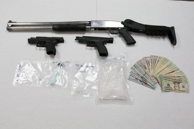Multiple drugs and guns were found inside a house at the 6700 block of South Santa Rosa Place, including 191 grams of marijuana, 226 grams of meth and scales, police said.