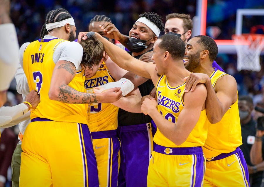 Dec. 15: Austin Reaves (15) was at the center of the Lakers celebration after hitting the winning 3 late in overtime to beat the Mavericks.