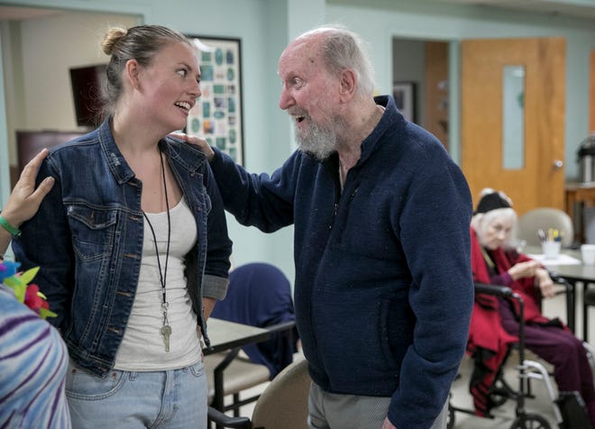 Activity assistant Holly Stoever talks to Jack Taylor at AGE of Central Texas Adult Day Health Center in 2019. AGE will be able to open an adult day health center in South Austin because of a $2 million grant from St. David's Foundation.