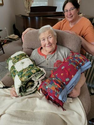Deb Shofstahl, right, with Sue Thomas, recently was among those who delivered a donation of blankets, coats and throws to Sue Thomas Ministries.