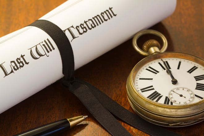 A scroll of a Last Will & Testament