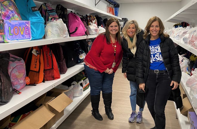 From left: Greensview Elementary teacher Michelle Johnson, After-School All-Stars Ohio Executive Director Tracy Ensign and the group's development manager, Renee O'Shaughnessy. They show off the many bags the nonprofit received from Greensview Elementary School in Upper Arlington. The school raised $7,000 and collected more than 200 bags.