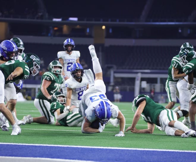 Gunter's Brayden Hinton gets upended just short of the end zone during the Class 3A Division II state championship game at AT&T Stadium in Arlington.