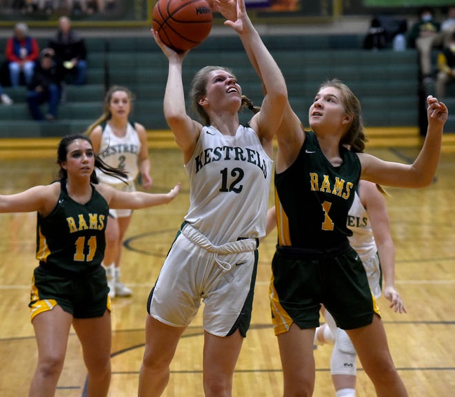 Audrey Cousino of SMCC goes to the hoop with Abigail Goldobin of Flat Rock applying the pressure Thursday, December 16, 2021. Behind Emma Smith of Flat Rock.