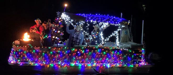 The Blackwater Pyrates' Captain Fins Up won the best theme award at the annual lighted boat parade. His theme was an old fashioned country Christmas.