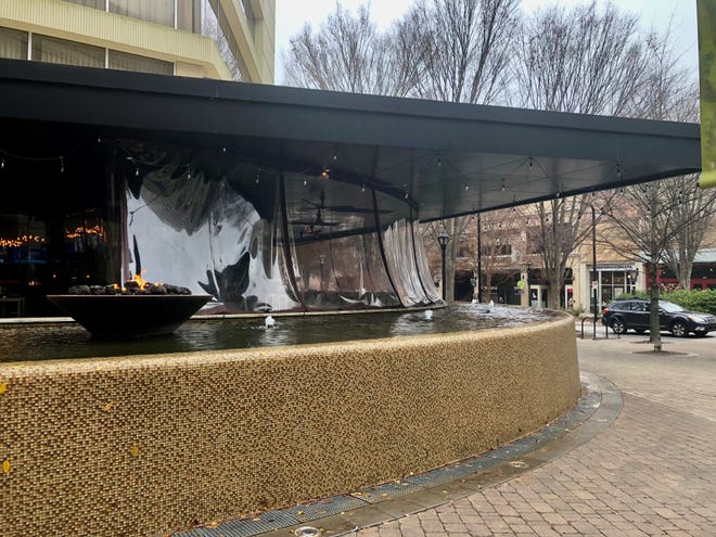 Reader questions allowance of 'potential slipping hazard', a water feature in front Roost restaurant/Hyatt on Main Street.