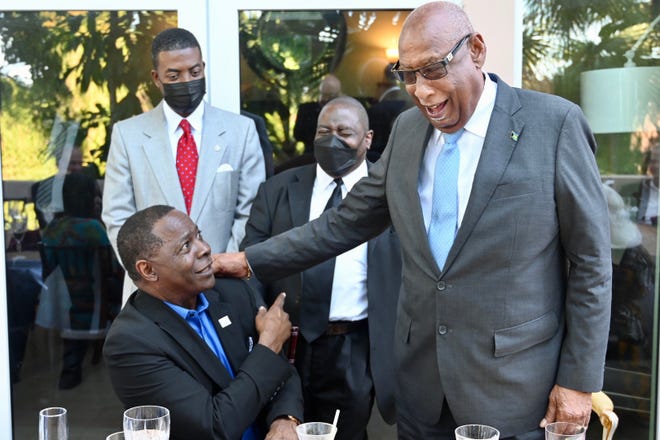 Bahamas Governor-General Sir Cornelius A. Smith congratulates MTSU President Sidney A. McPhee, a native of The Bahamas, for his 20 years as the university's top leader.