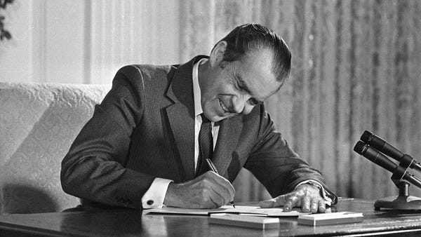 President Richard Nixon signs the National Cancer 