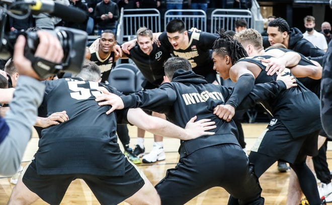 The Purdue Boilermakers warm up to take on the Butler Bulldogs during the Crossroads Classic college basketball tournament on Saturday, Dec. 18, 2021, at Gainbridge Fieldhouse in Indianapolis. 