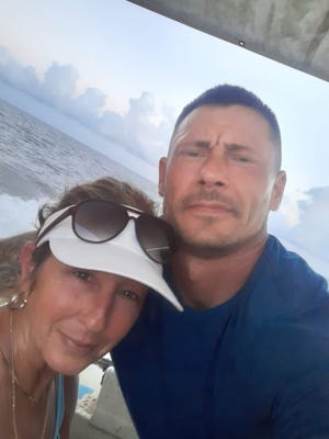 Siblings Justin Smith and Stacia Johnson on a boat on Lake Pontchartrain.