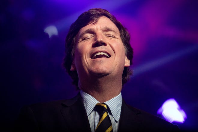 Tucker Carlson during the first day of the AmericaFest hosted by Turning Point USA on Saturday, Dec. 18, 2021, in Phoenix.