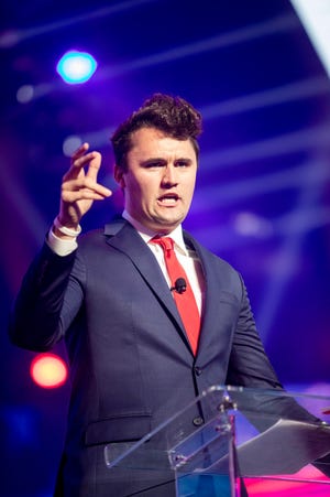 Charlie Kirk speaks to supporters during the first day of AmericaFest, hosted by Turning Point USA on Dec. 18, 2021, in Phoenix.