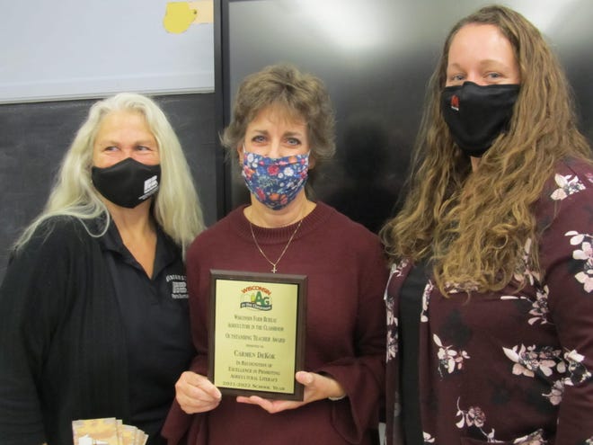 Carmen DeKok (center) was awarded Wisconsin Farm Bureau’s Ag in the Classroom program’s Outstanding Teacher of the Year Award by Rock County Ag in the Classroom Committee members Sheila Everhart (left) and Stacy Skemp (right).