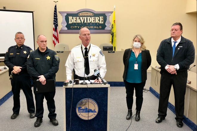 Belvidere Police Chief Shane Woody (center) holds a news conference on Monday, Dec. 20, 2021, concerning a triple homicide at the 600 block of Union Avenue.