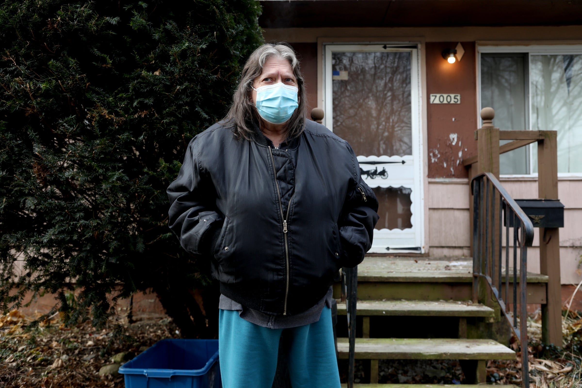 Terry Weaver stands in her Webster Woods neighborhood, across the street from the Dort-Carpenter Industrial Park, which is about a quarter-mile from the soon to be built Ajax Asphalt plant. The area around her has a number of other polluting factories and hazardous waste sites, including a wood-burning, power-generating incinerator.