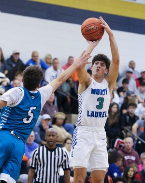 North Laurel's Reed Sheppard (3) shot a jumper against North Oldham's Jack Scales (5) during their game in the King of the Bluegrass Holiday Classic tournament at the Fairdale High School in Louisville, Ky. on Dec. 19, 2021.