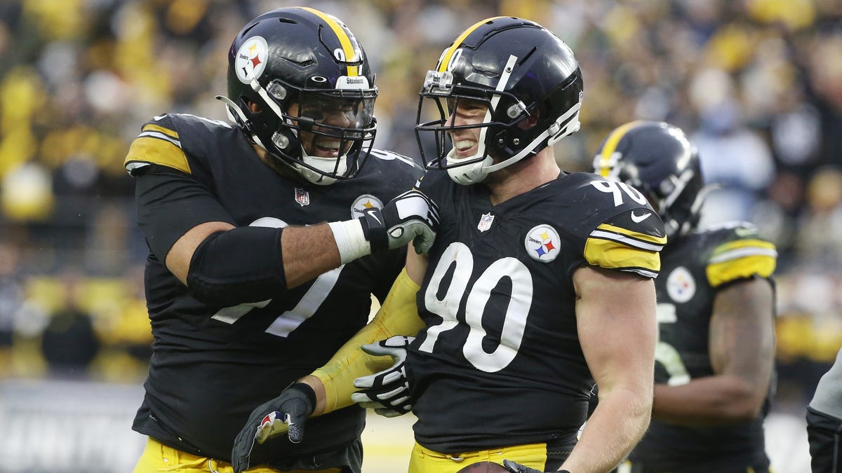 Pittsburgh Steelers defensive end Cameron Heyward (97) and outside linebacker T.J. Watt (90) celebrate after a fumble recovery by Watt against the Tennessee Titans during the fourth quarter at Heinz Field.
