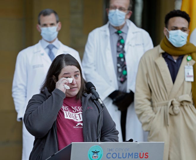 Tracie Hayes, manager nurse in Mt. Carmel Health's Med/Surge unit, speaks tearfully about her experiences in the fight against COVID-19 during a press conference at Columbus Public Health on Tuesday, December 21, 2021.