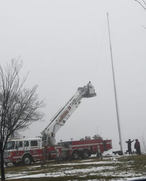 The flag at Landslide Park on West Sixth Street was recently replaced after the rope broke and the Crookston Fire Department can be seen here working on the replacement. Firefighter Brian Hanson told the Times that the flag is replaced by the city every 6-9 months or so and regular maintenance is also done on the large attraction.