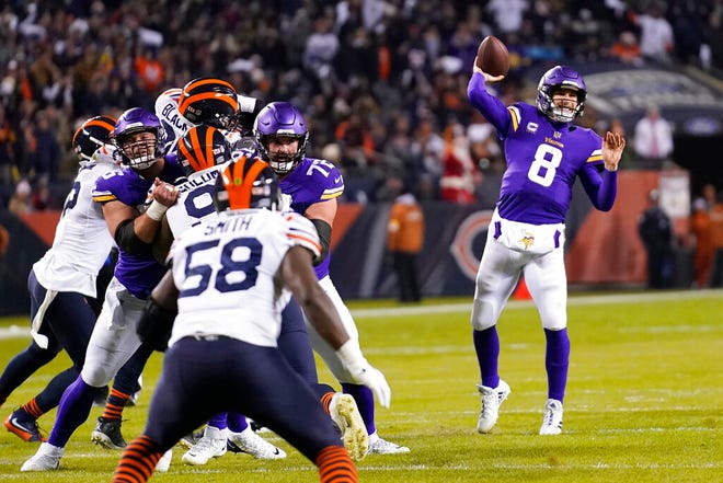 Minnesota Vikings quarterback Kirk Cousins throws a touchdown pass to Justin Jefferson during the first half of an NFL football game against the Chicago Bears Monday, Dec. 20, 2021, in Chicago. (AP Photo/Nam Y. Huh)