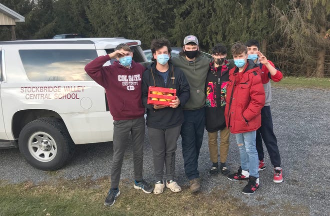 Stockbridge Valley Central School Agriculture Production students, from left, Tim Bernet, Robby Wagner, Logan Brown, Hayden Dye, Alex Smith and Devin Smith help deliver community baskets of goodies Dec. 21 around Munnsville.