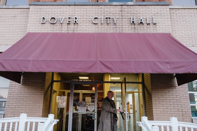 Dover Mayor Richard Homrighausen exits City Hall after firing three people at the end of the business day. When questioned about the events, the mayor said he was, " ... just taking care of business." Tuesday, Dec 21 in Dover.