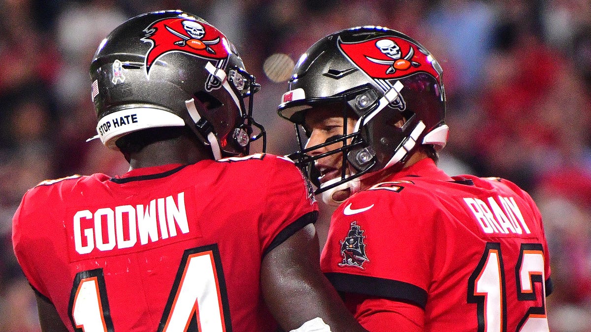 Chris Godwin of the Tampa Bay Buccaneers celebrates with teammate Tom Brady after scoring a touchdown during the first quarter against the New York Giants.