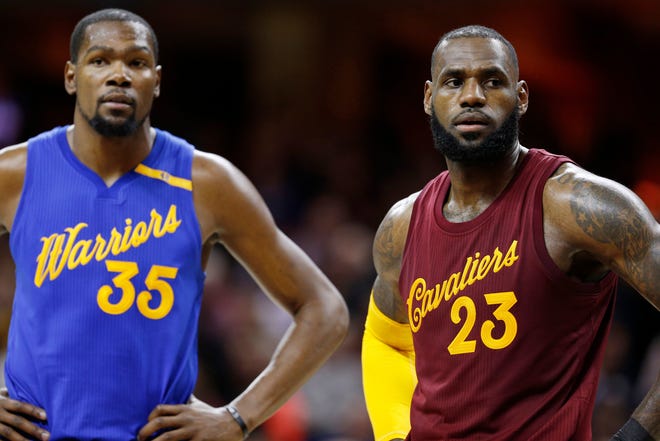 Golden State Warriors forward Kevin Durant and Cleveland Cavaliers forward LeBron James during a Christmas Day game at Quicken Loans Arena.